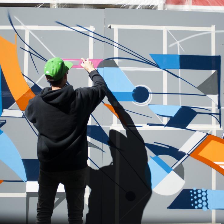 Vans the Omega graffiti artist at work in the Canberra Museum and Gallery courtyard, Canberra, Australian Capital Territory © Martin Ollman, VisitCanberra Vans the Omega graffiti artist at work in the Canberra Museum and Gallery courtyard, Canberra, Australian Capital Territory © Martin Ollman, VisitCanberra