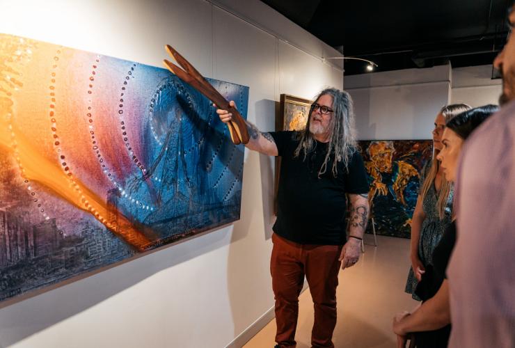 Looking at the art with artist at Birrunga Gallery & Dining, Brisbane, Queensland © Jesse Lindemann, Tourism and Events Queensland Looking at the art with artist at Birrunga Gallery & Dining, Brisbane, Queensland © Jesse Lindemann, Tourism and Events Queensland
