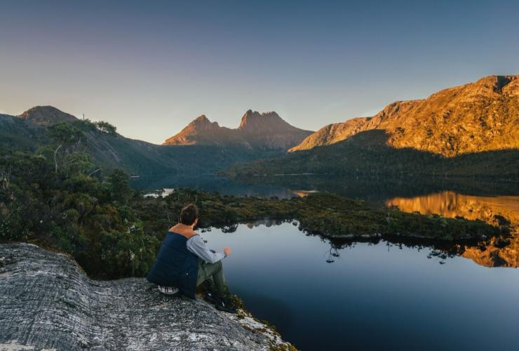 Man admires the sunset over Cradle Mountain along the Cradle Mountain Signature Walk, TAS © Tourism Tasmania Man admires the sunset over Cradle Mountain along the Cradle Mountain Signature Walk, TAS © Tourism Tasmania