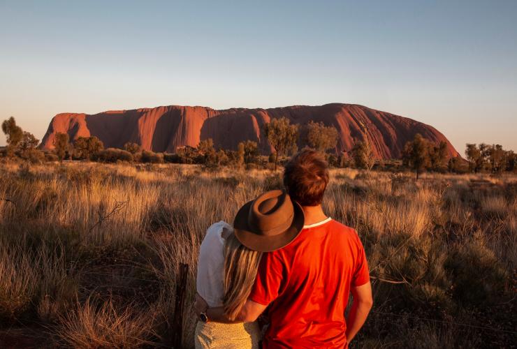 Couple at Uluru at sunrise © Tourism Australia/Nicholas Kavo Couple at Uluru at sunrise © Tourism Australia/Nicholas Kavo