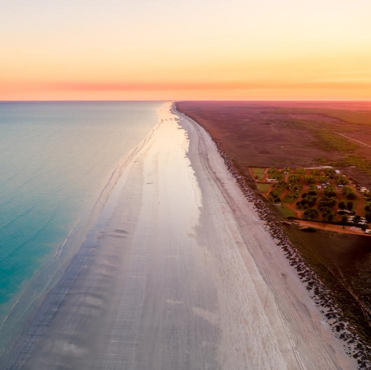 Aerial view over Eighty Mile Beach at sunrise © Australia’s North West, CJ Maddock (@awaywithcj) Aerial view over Eighty Mile Beach at sunrise © Australia’s North West, CJ Maddock (@awaywithcj)