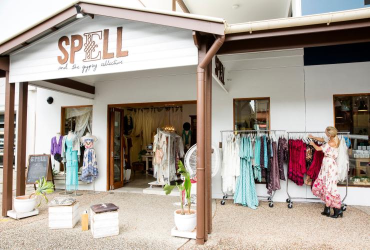 Woman arranging clothes for display at the Spell & The Gypsy Collective in Byron Bay © Destination NSW Woman arranging clothes for display at the Spell & The Gypsy Collective in Byron Bay © Destination NSW