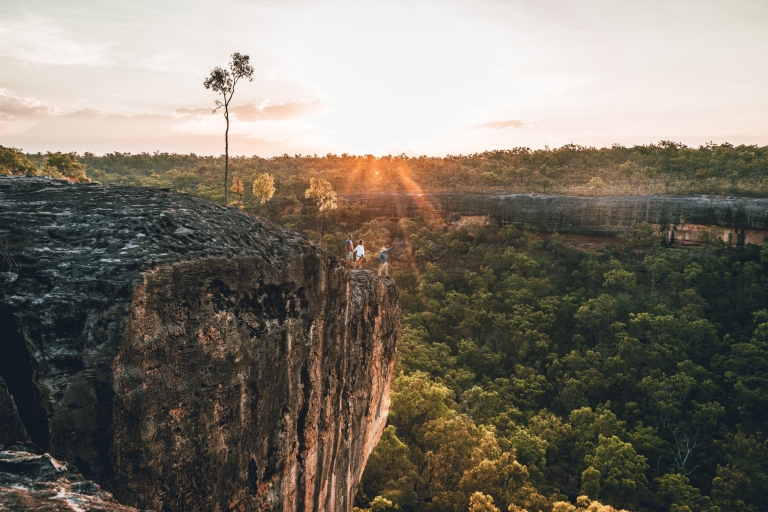 An Aboriginal tour guide and two guests standing on a rocky outcrop overlooking green bushland during a tour with Jarramali Rock Art Tours, Tropical North Queensland, Queensland © Tourism Tropical North Queensland An Aboriginal tour guide and two guests standing on a rocky outcrop overlooking green bushland during a tour with Jarramali Rock Art Tours, Tropical North Queensland, Queensland © Tourism Tropical North Queensland