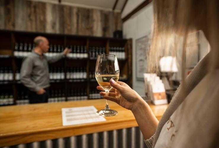 Woman holding a glass of white wine during a wine tasting at Tyrrell’s Wines © Rob Mulally Woman holding a glass of white wine during a wine tasting at Tyrrell’s Wines © Rob Mulally