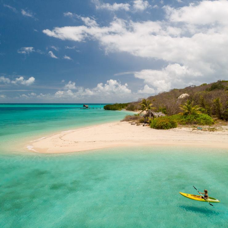 Person in kayak paddles in the ocean next to Haggerstone Island © Tourism and Events Queensland Person in kayak paddles in the ocean next to Haggerstone Island © Tourism and Events Queensland