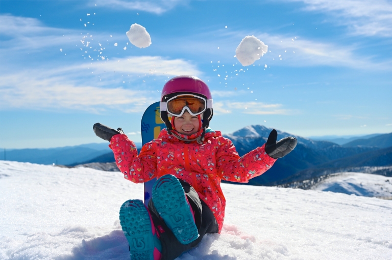 A child sitting on a snowy peak throwing snowballs in the air, Hotham Alpine Resort, Mt Hotham, Victoria © Hotham Alpine Resort A child sitting on a snowy peak throwing snowballs in the air, Hotham Alpine Resort, Mt Hotham, Victoria © Hotham Alpine Resort