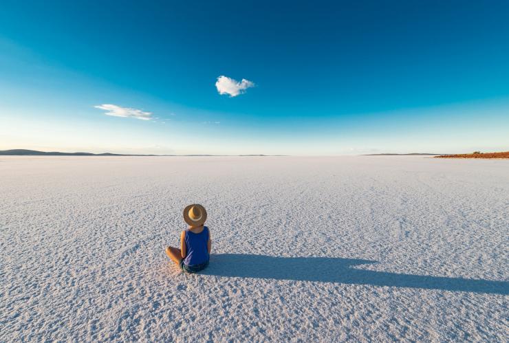 Women wearing a hat sits on the salt flats of Lake Gairdner in South Australia © South Australian Tourism Commission Women wearing a hat sits on the salt flats of Lake Gairdner in South Australia © South Australian Tourism Commission