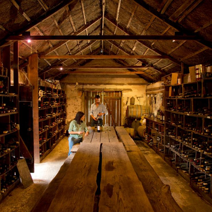 Two people enjoying a wine tasting in a wine cellar at Brand's Laira, Coonawarra, Adelaide, South Australia © Adam Bruzzone Two people enjoying a wine tasting in a wine cellar at Brand's Laira, Coonawarra, Adelaide, South Australia © Adam Bruzzone