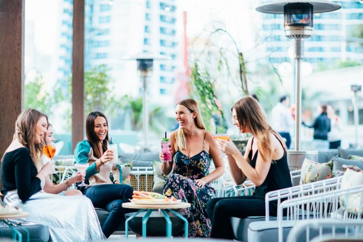 Friends at The Island Rooftop Bar on the Gold Coast © Destination Gold Coast Friends at The Island Rooftop Bar on the Gold Coast © Destination Gold Coast
