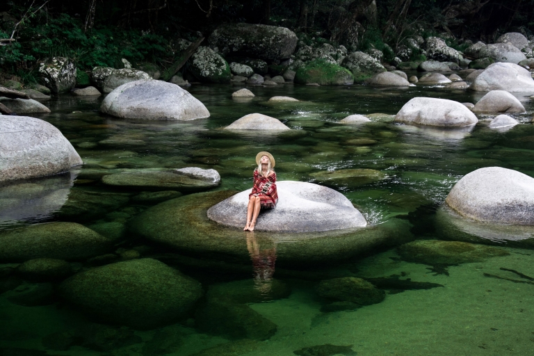 Woman sitting on a boulder in Mossman Gorge in the Daintree National Park © Luxury Lodges of Australia Woman sitting on a boulder in Mossman Gorge in the Daintree National Park © Luxury Lodges of Australia
