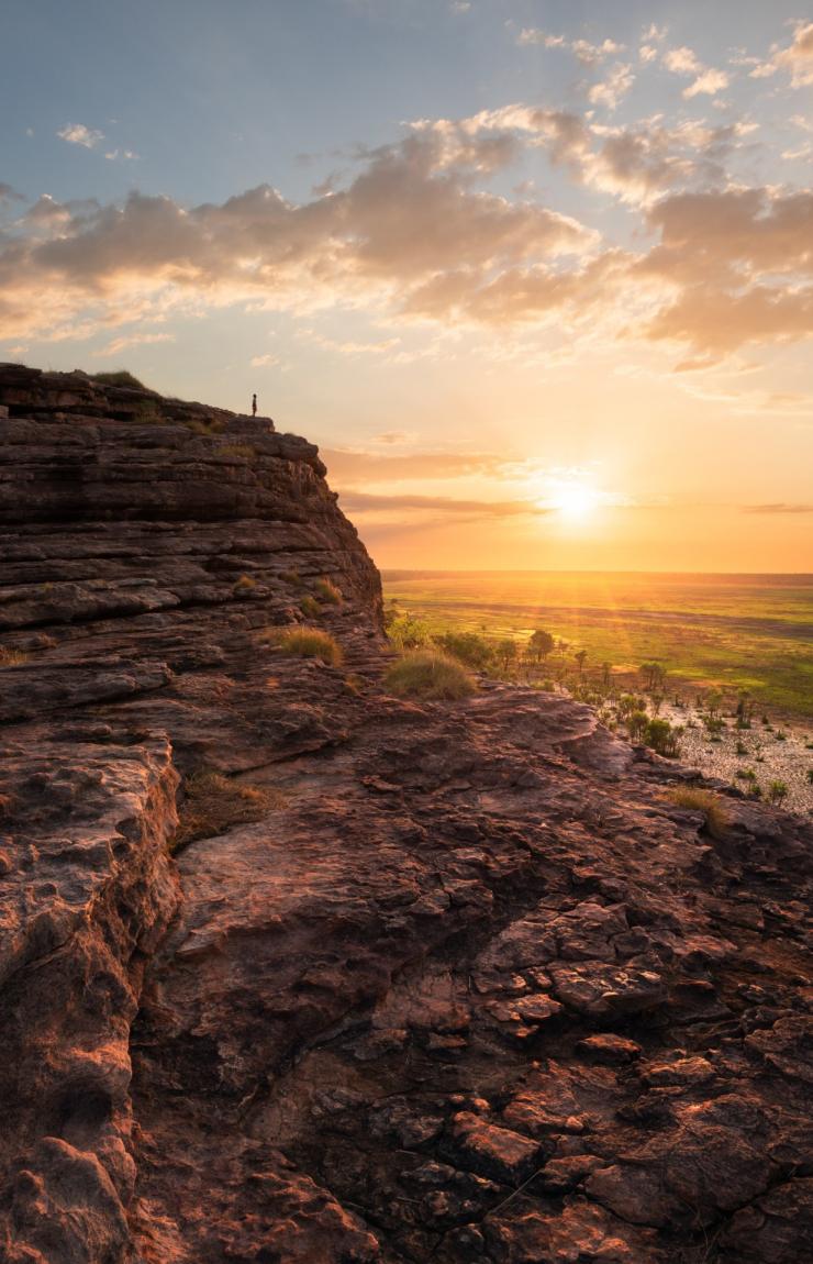Man standing on the top of the rock in Ubirr, Kakadu National Park © Tourism NT/Daniel Tran9 Man standing on the top of the rock in Ubirr, Kakadu National Park © Tourism NT/Daniel Tran9
