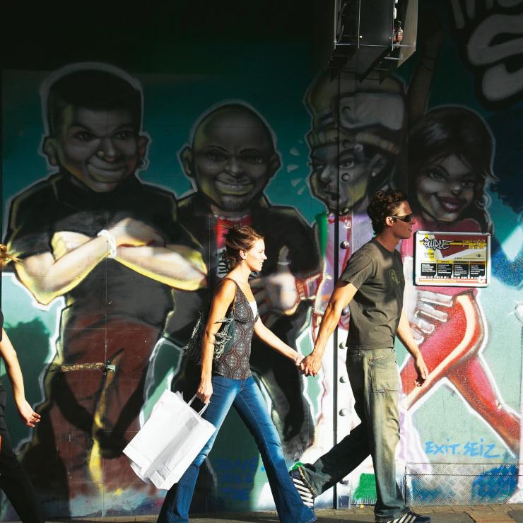 People walk past a wall of street art on Ann Street, Brisbane, Queensland © Chris McLennan People walk past a wall of street art on Ann Street, Brisbane, Queensland © Chris McLennan