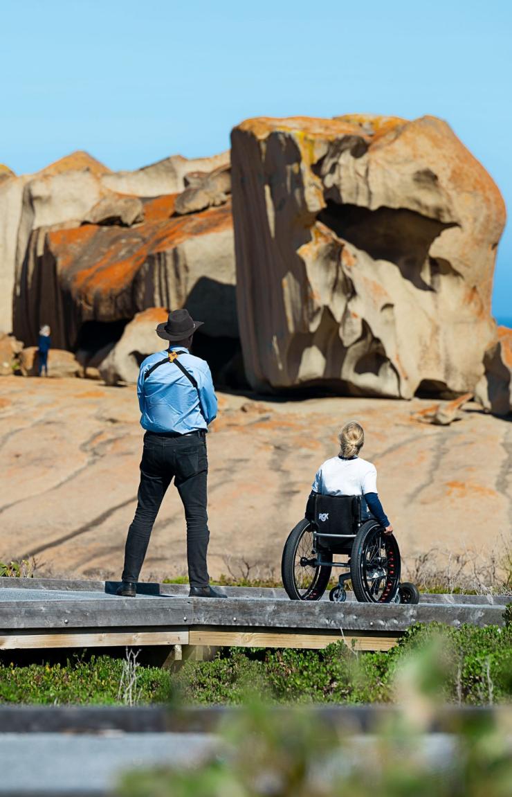 Two people gaze at the Remarkable Rocks, Kangaroo Island, South Australia © Tourism Australia