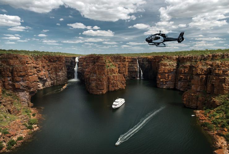 Ship and helicopter near waterfalls, True North, The Kimberley, WA © True north Adventure Cruises Ship and helicopter near waterfalls, True North, The Kimberley, WA © True north Adventure Cruises