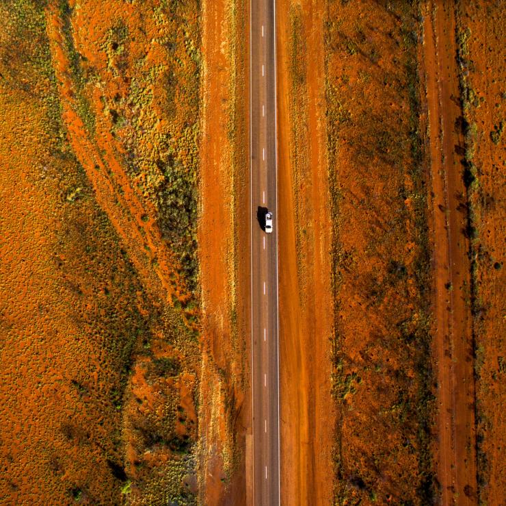 Aerial of a car driving along the Stuart Highway in the Alice Springs Region © Sam Earp, Tourism NT Aerial of a car driving along the Stuart Highway in the Alice Springs Region © Sam Earp, Tourism NT