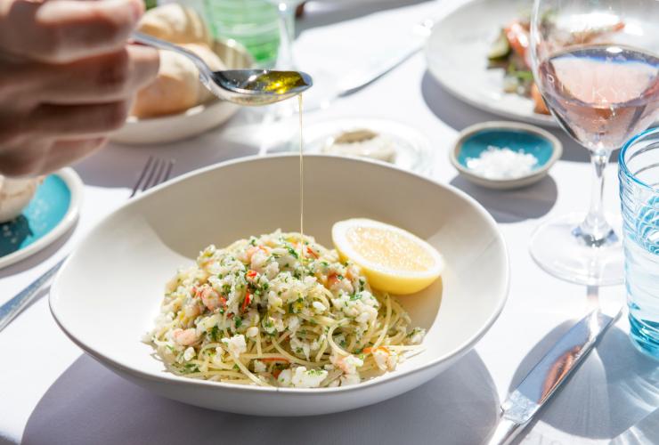 Spanner crab spaghetti dish at Ricky’s River Bar and Restaurant in Noosa Heads © Visit Noosa