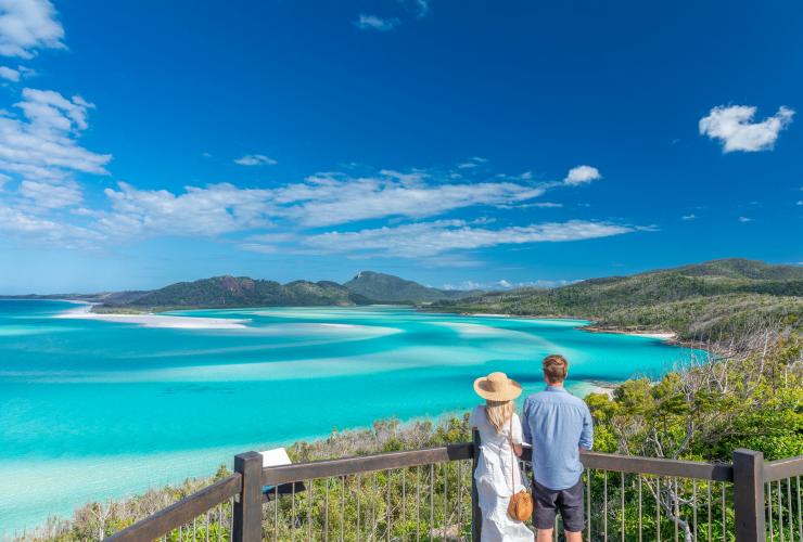 Couple admire view over the Whitsundays from Hill Inlet © Riptide Creative Couple admire view over the Whitsundays from Hill Inlet © Riptide Creative