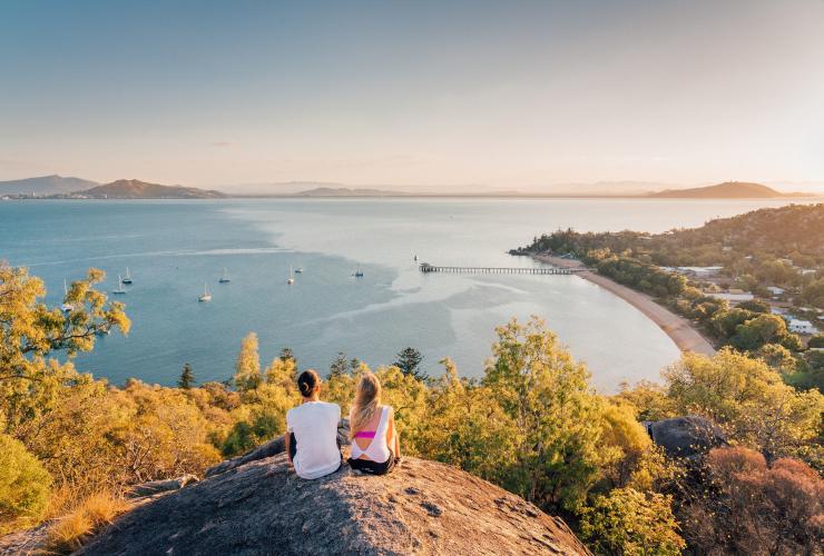 Two girls sat on Hawkins Point looking out to sea © Tourism and Events Queensland Two girls sat on Hawkins Point looking out to sea © Tourism and Events Queensland
