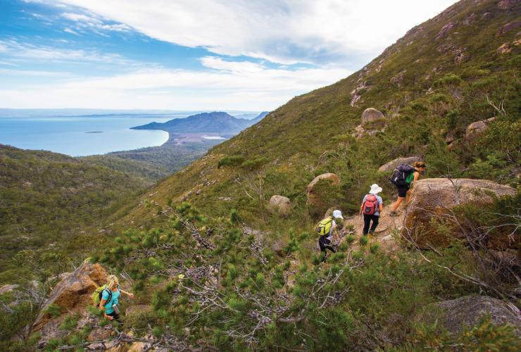 Woman walking the Freycinet Experience Walk in Freycinet National Park © Friendly Beaches Lodge / Great Walks of Australia Woman walking the Freycinet Experience Walk in Freycinet National Park © Friendly Beaches Lodge / Great Walks of Australia