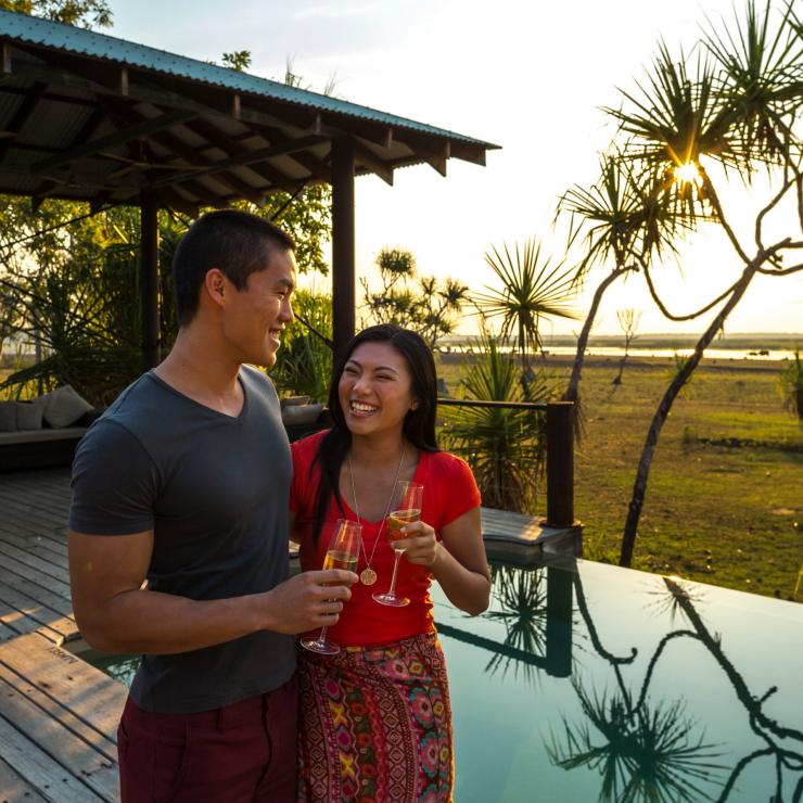 Visitors drinking champagne next to the infinity pool at Bamurru Plains © Tourism NT/Peter Eve Visitors drinking champagne next to the infinity pool at Bamurru Plains © Tourism NT/Peter Eve